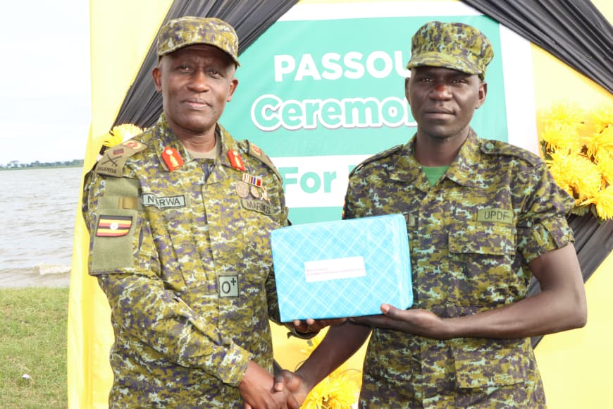 Brig-Gen-Micheal-Nyarwa-Awarding-the-Best-Overall-Student-Pte-Poloya-Deogracious