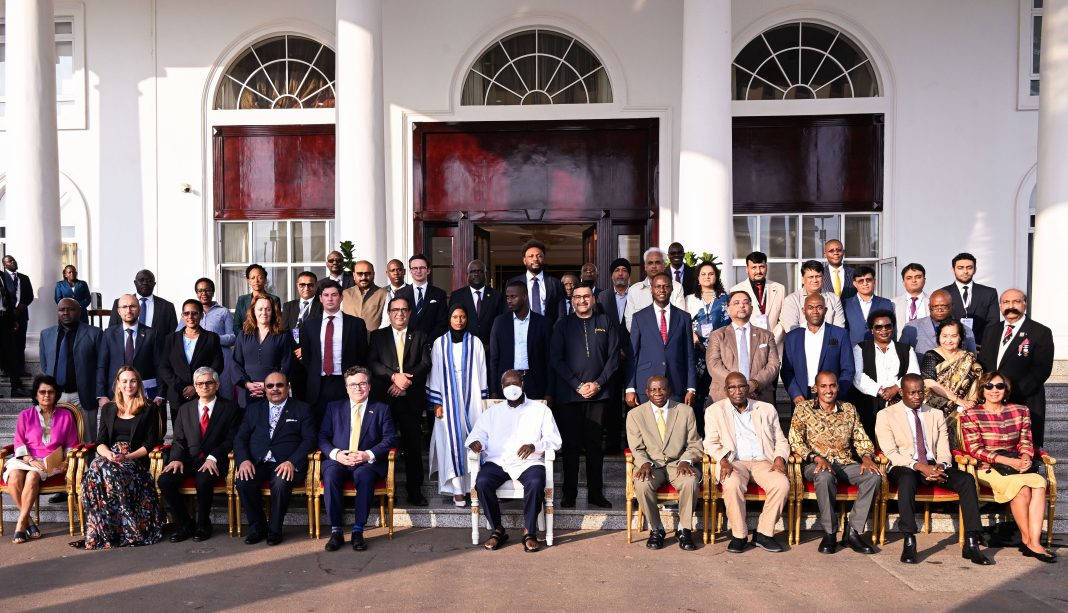 President Museveni (C) poses for a photo with investors from UK's West Minister Africa Business Association and South Asia Chamber of commerce from india who met him at State House Entebbe on Monday. PPU Ph