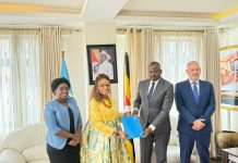 Hon. Kyeyune Haruna Kasolo receives the World Food Programme Country Director