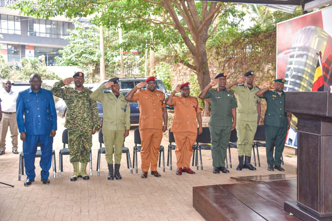 UPDF-AND-SECURITY-SISTERS-SALUTING-THE-NATIONAL-ANTHEM-AT-PRESS-BRIEFING