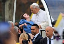 Pope celebrates giant Paris mass, flies to Lourdes