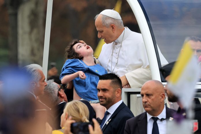 Pope celebrates giant Paris mass, flies to Lourdes